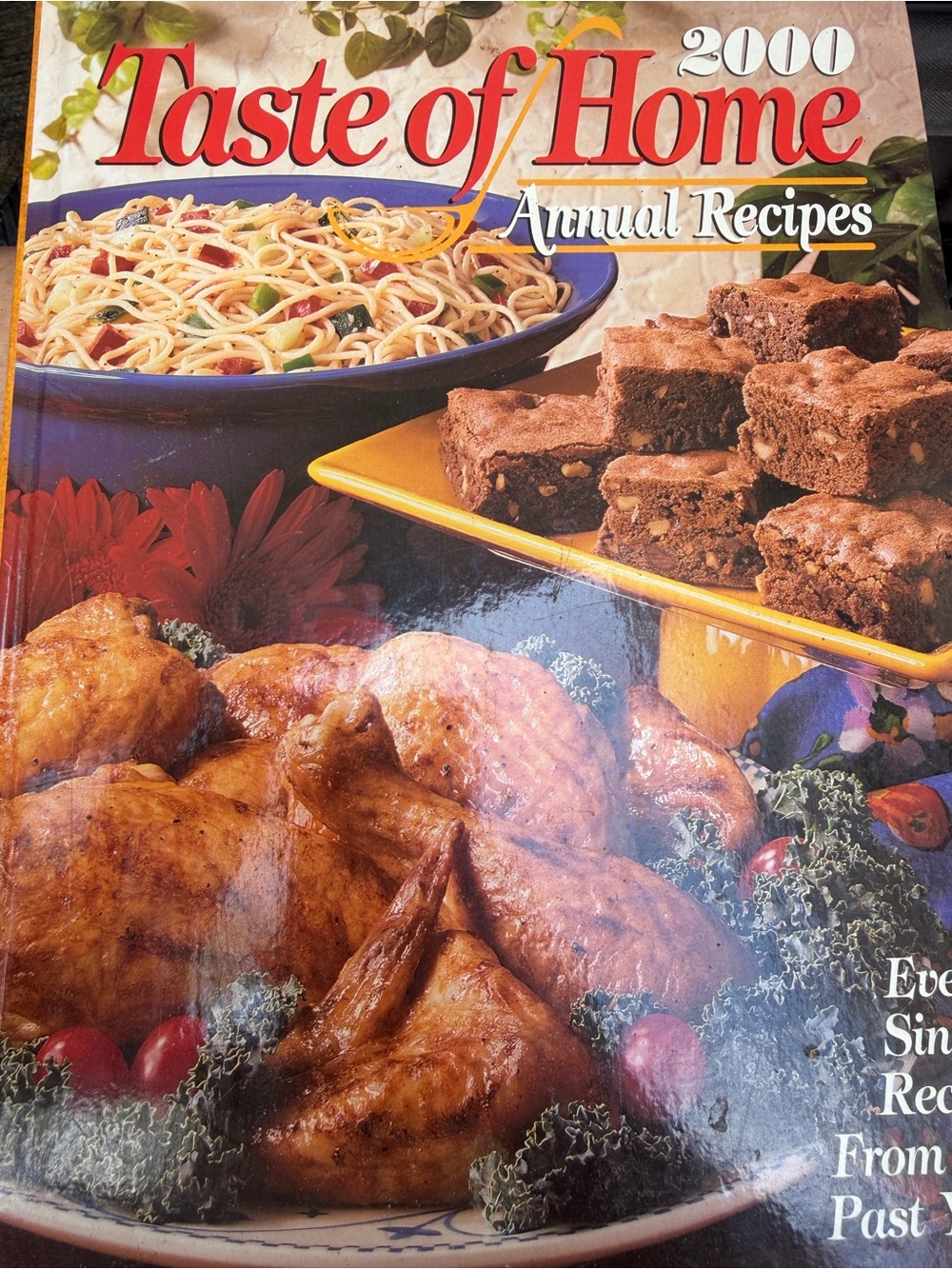 Taste of Home Cookbook with Red, Blue, Yellow, Brown Cover Artwork